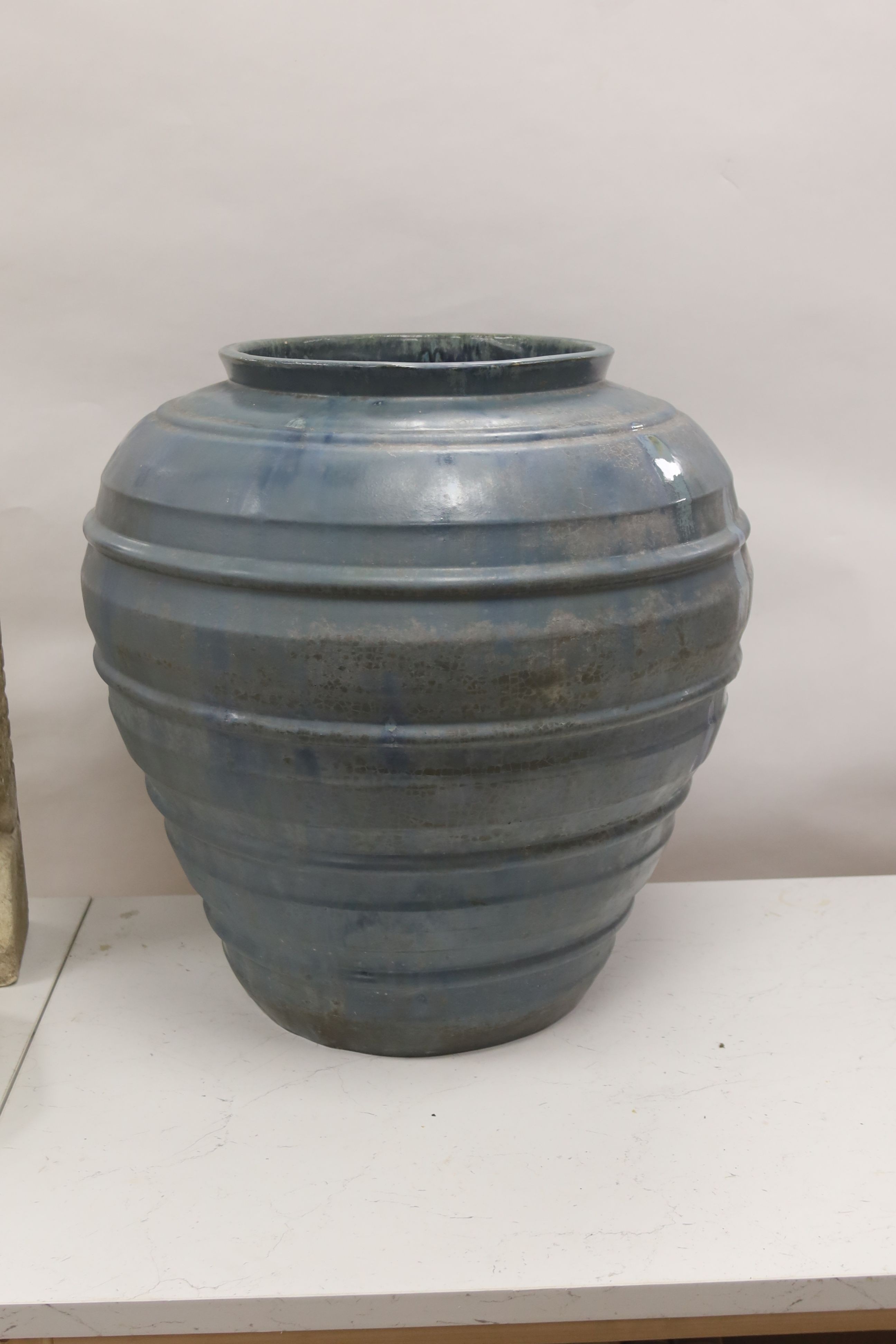 A large blue glazed terracotta pot 53cm